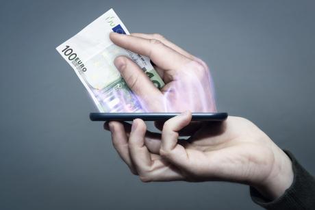 Money coming out of a mobile screen